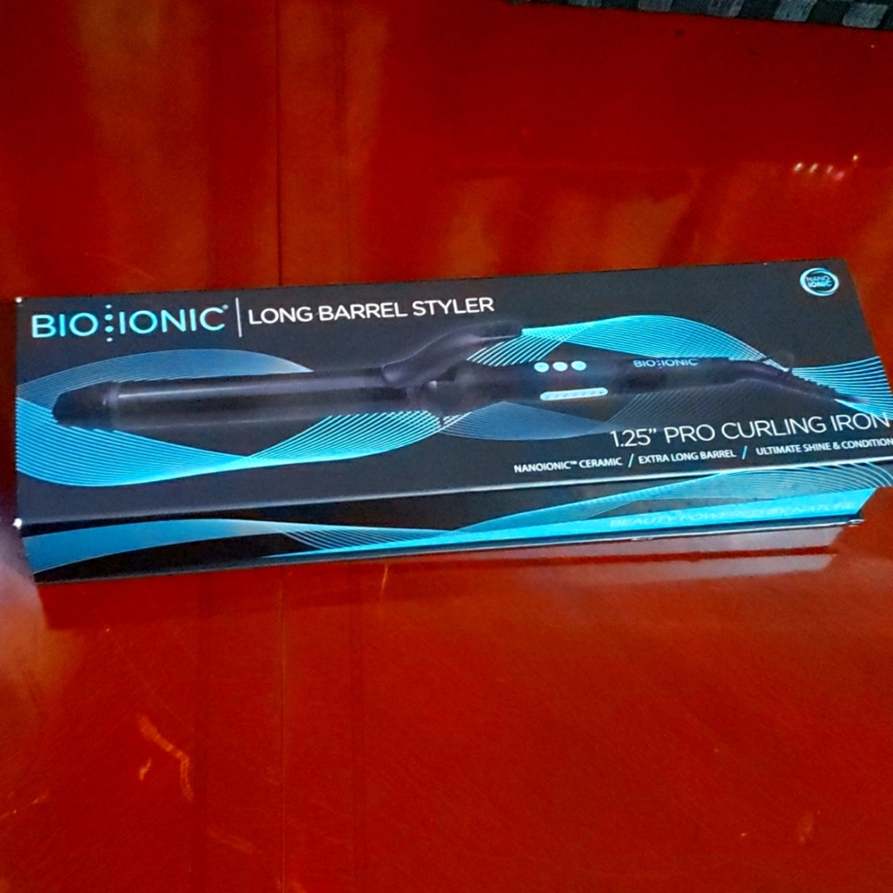 New in box never opened bio ionic long barrel  styler curling iron